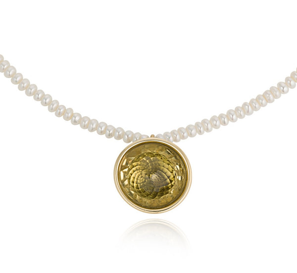 A contemporary pearl necklace with a Citrine ball pendant